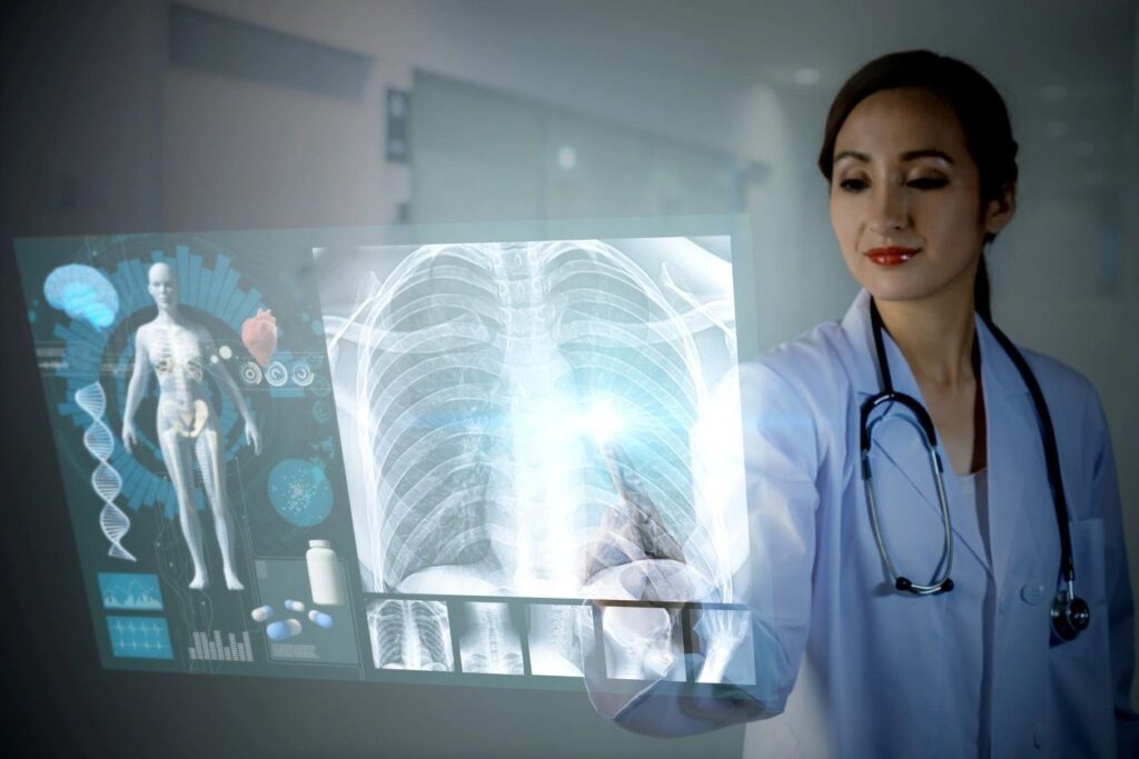 Healthcare provider examining a X-ray image.